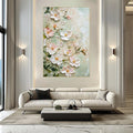 Floral painting above a white sofa in a modern living room