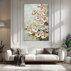 Floral painting above a white sofa in a living room setting