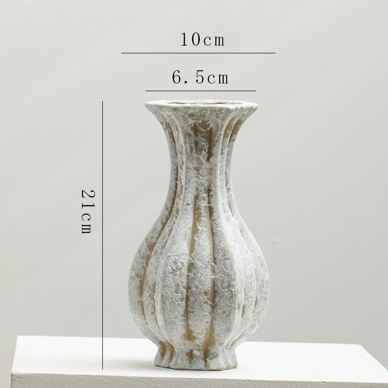 Elegant artisan vase with vintage charm, perfect for living room decor