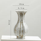 Elegant artisan vase with vintage charm, perfect for living room decor