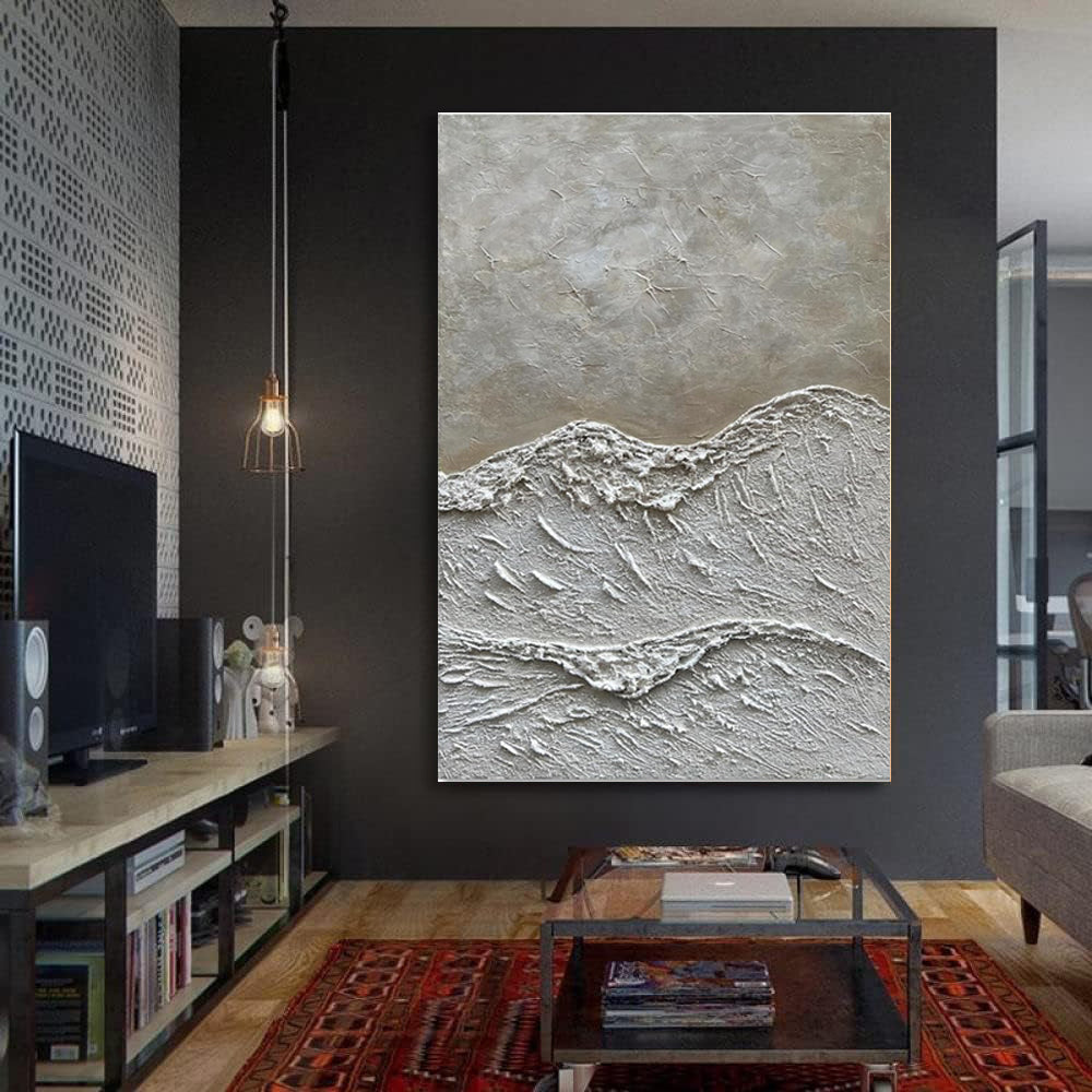 Living room with a textured wall art piece on a dark wall.